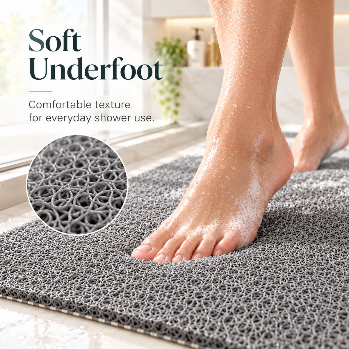 A gray textured shower mat shown in a bathroom setting with a person's foot stepping onto it, plus a circular inset highlighting the soft underfoot texture. Text on the image reads 'Soft Underfoot' and 'Comfortable texture for everyday shower use.