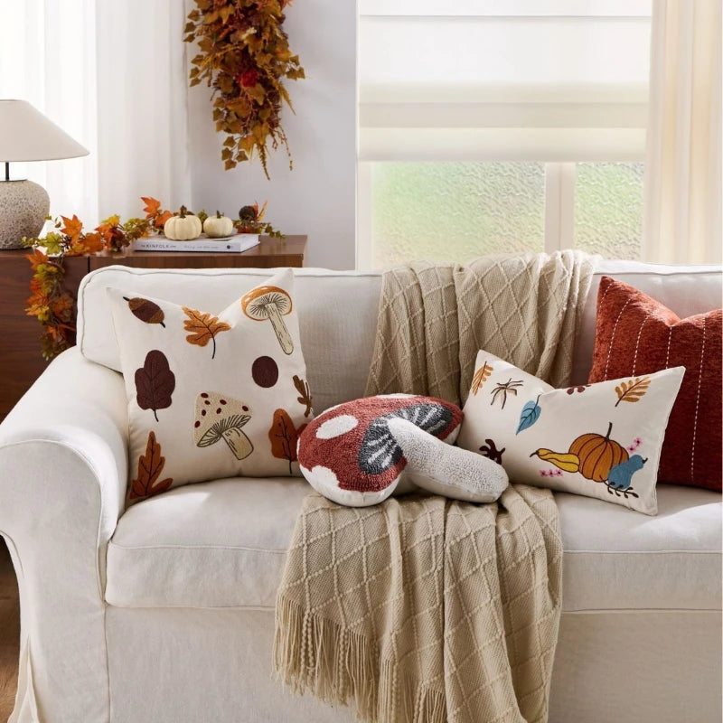 Decorative throw pillow cover featuring a Nordic maple leaf design in warm autumn colors. Made from soft, durable fabric, it adds a cozy accent to any 1