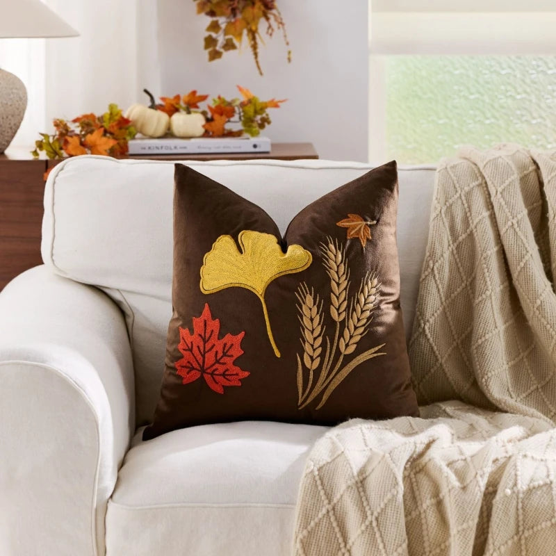 Autumn throw pillow cover featuring a Nordic maple leaf design in warm orange and earthy tones. Made from soft, durable fabric, this decorative accent adds a 4