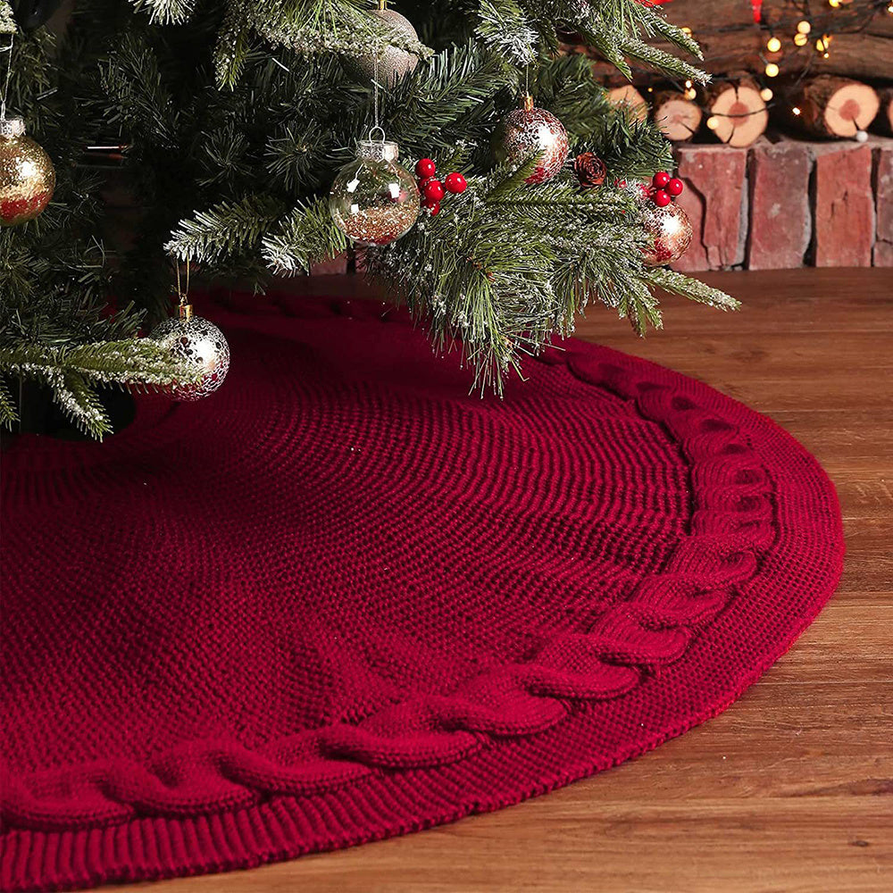 Cozy round Christmas tree skirt in soft cream color with a textured cable knit pattern, perfect for holiday decor. Adds a warm and festive touch to your 1