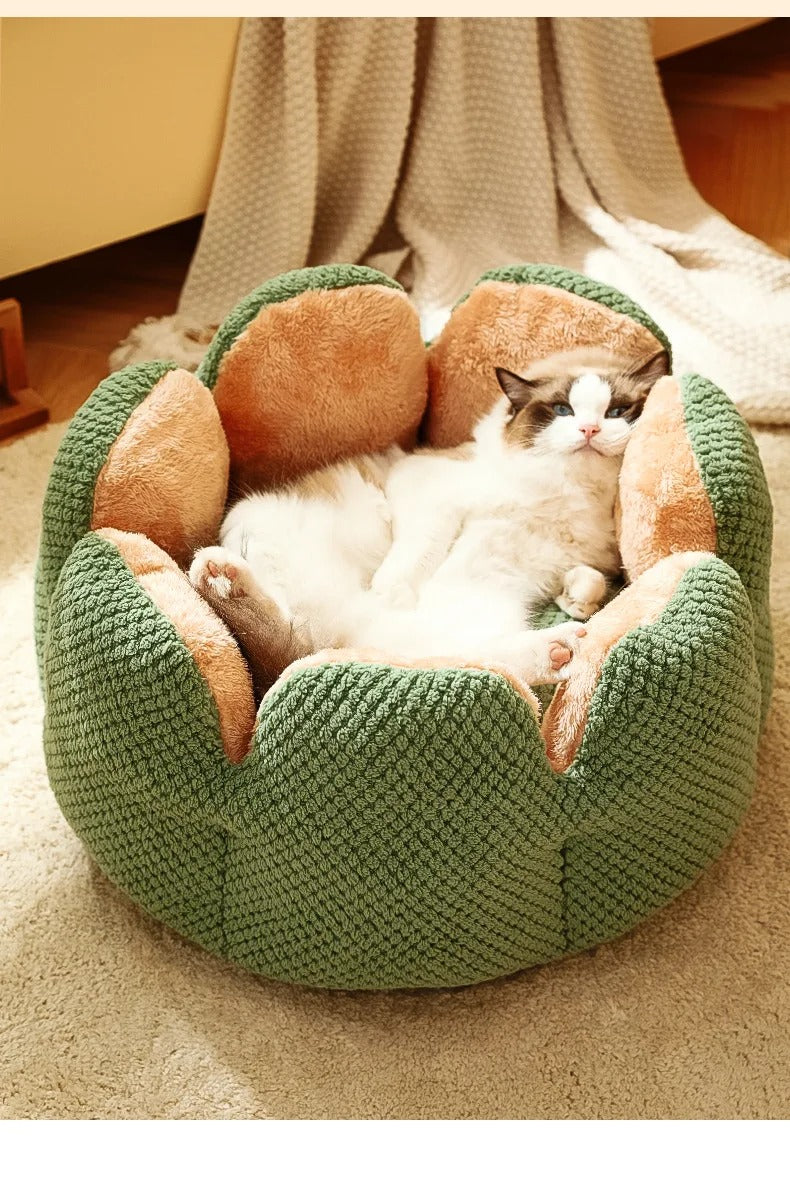 Cozy flower-shaped cat bed made from plush fabric, featuring a soft pink color. Measuring 19.7 inches in diameter, it provides a warm 6