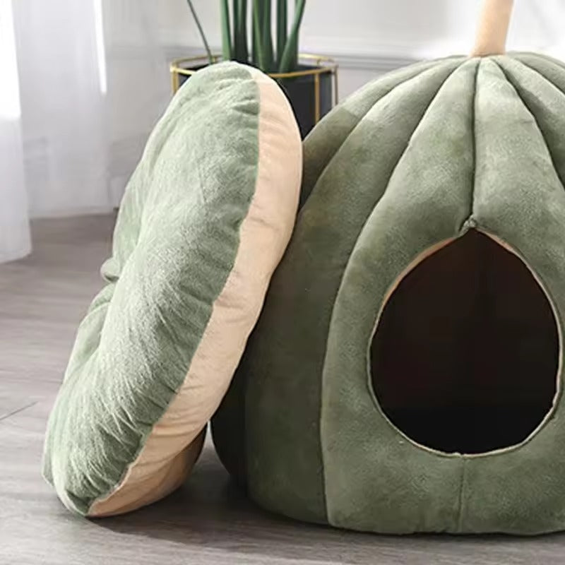 Cozy cat cave bed made from soft plush fabric, featuring a playful green pumpkin design. Measuring 19.7 x 19.7 x  2
