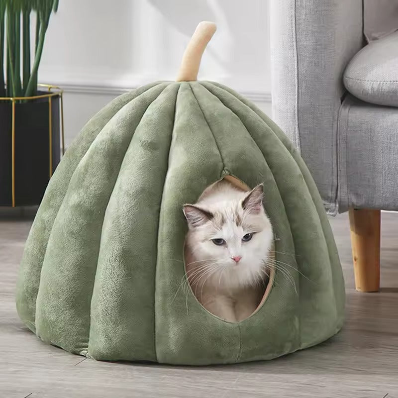 Cozy cat cave bed made of soft plush fabric in a green pumpkin design, offering a warm retreat for cats. Measures 19.7 x  3