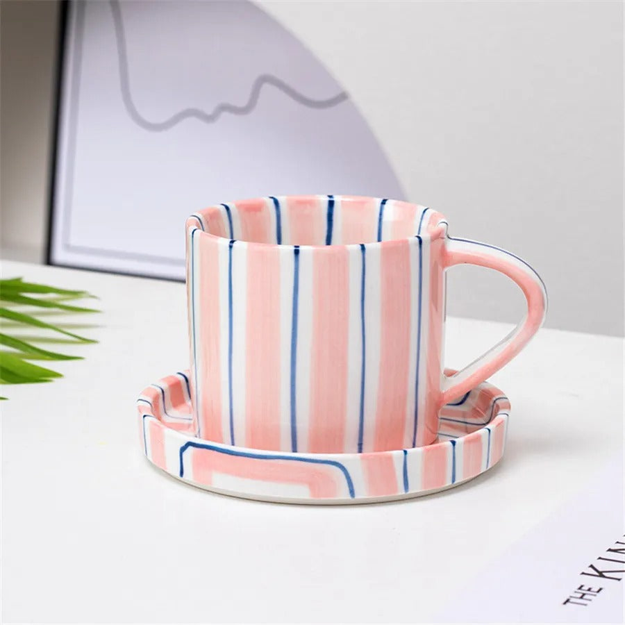 Handpainted ceramic coffee cup and saucer set featuring a charming French retro design. The set showcases intricate floral patterns in soft pastel colors, perfect for 3