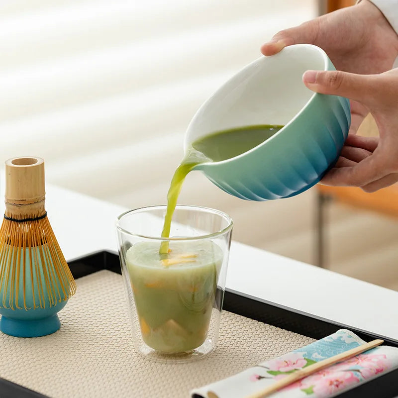 Colorful 6-piece ceramic matcha bowl set featuring unique spouts for easy pouring. Each bowl displays vibrant, hand-painted patterns, perfect for tea 4
