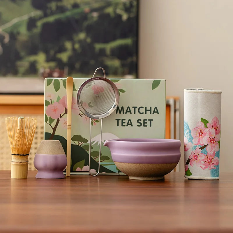 Elegant ceramic matcha tea set featuring a smooth green bowl, bamboo whisk, spoon, and matching accessories, perfect for preparing traditional matcha. The set 0