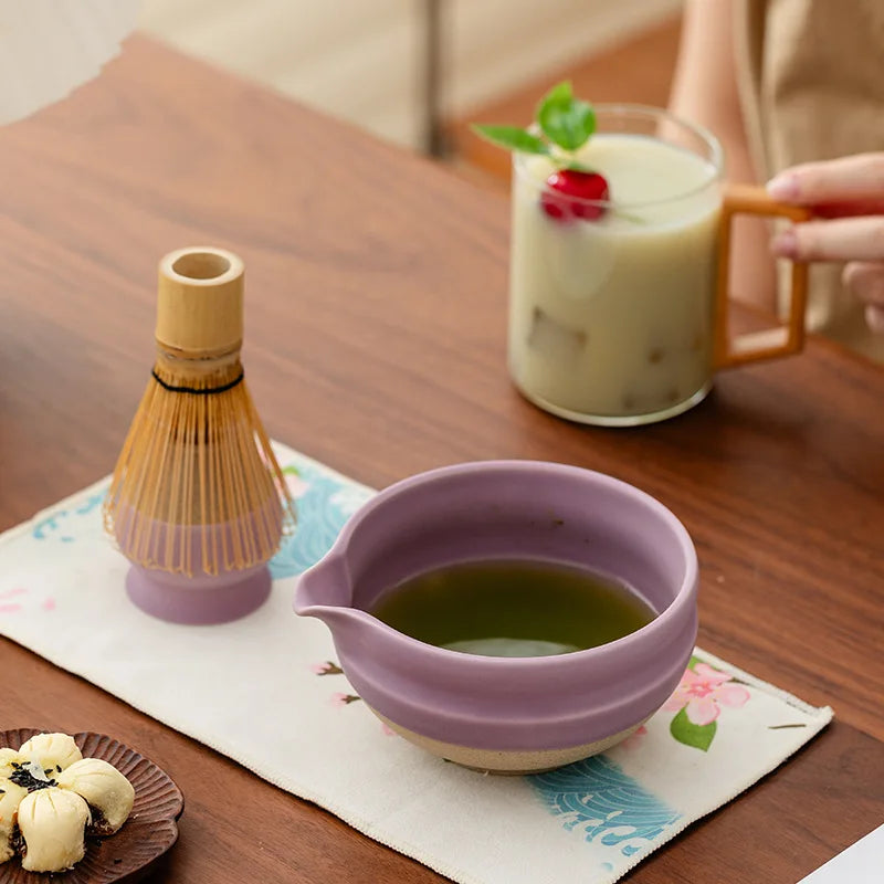 Elegant ceramic matcha tea set featuring a smooth green bowl, bamboo whisk, spoon, and matching accessories, perfect for preparing traditional matcha. The set 1