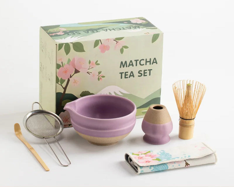 Elegant ceramic matcha tea set featuring a smooth green bowl, bamboo whisk, spoon, and matching accessories, perfect for preparing traditional matcha. The set 4