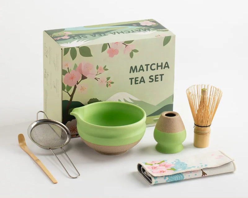 Elegant ceramic matcha tea set featuring a smooth green bowl, bamboo whisk, spoon, and matching accessories, perfect for preparing traditional matcha. The set 5