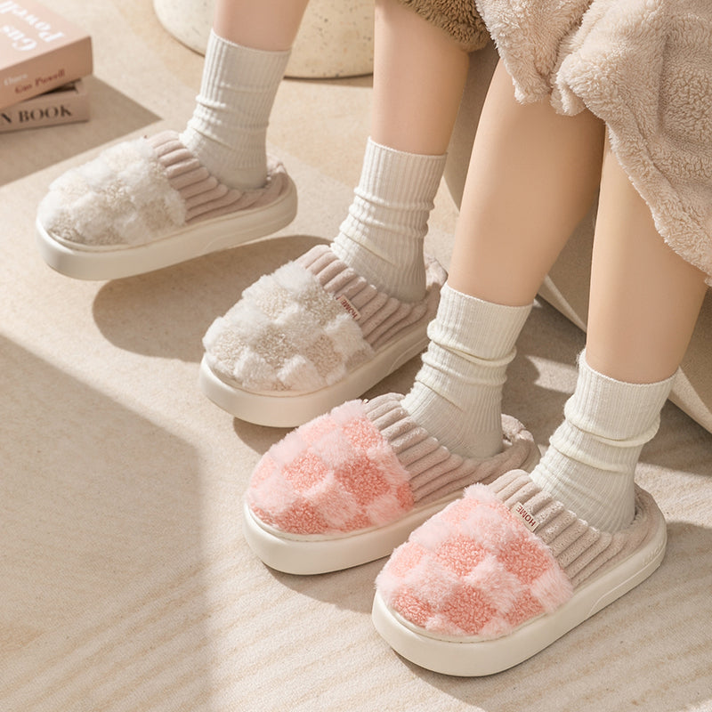 Cozy checkered plush women's slippers in soft gray and white. Features a cushioned insole and anti-slip sole for safety. Perfect for keeping feet 1