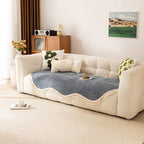 Elegant chenille woven sofa cover in soft cream color, featuring decorative tassels for a stylish touch. This durable slipcover is designed to protect and enhance 1
