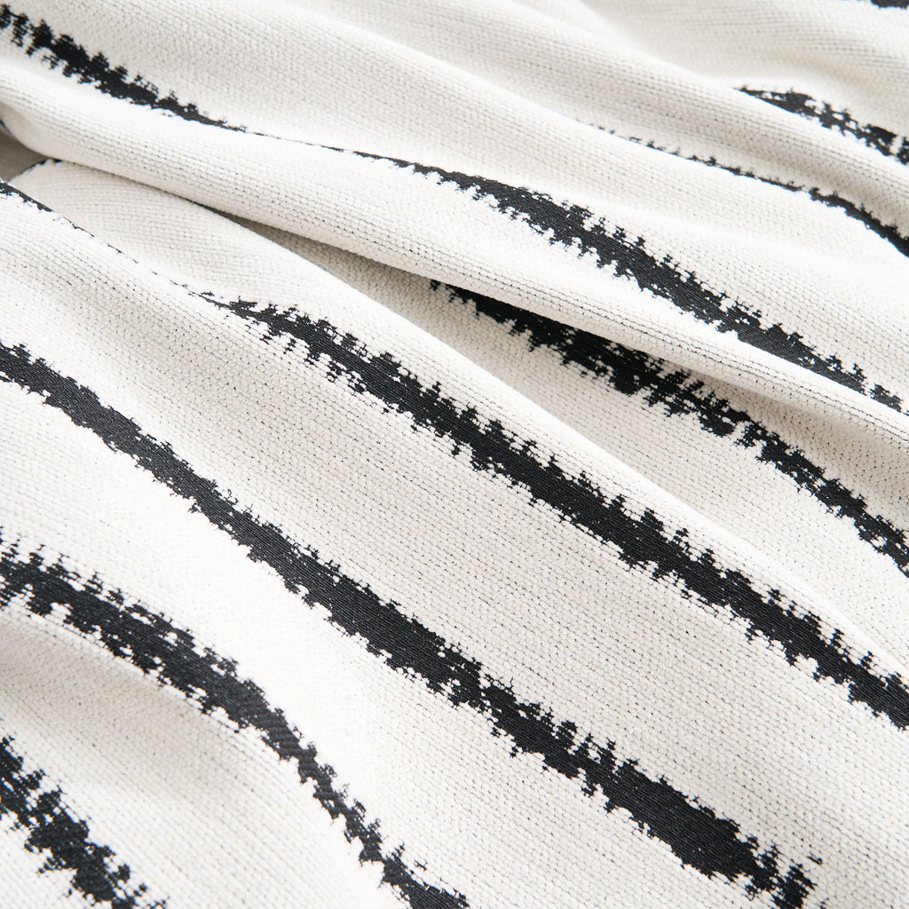 Stylish square pattern sofa cover in soft, pet-friendly fabric. The cover is designed to fit most couches, offering a modern touch while protecting furniture. 4