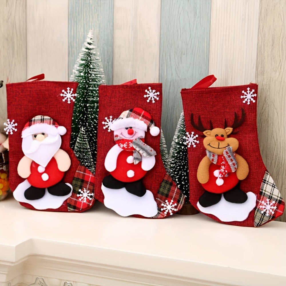 Set of three Christmas stockings featuring Santa, a snowman, and a reindeer. Made from red fabric with colorful embroidered designs. Perfect for festive decoration 0