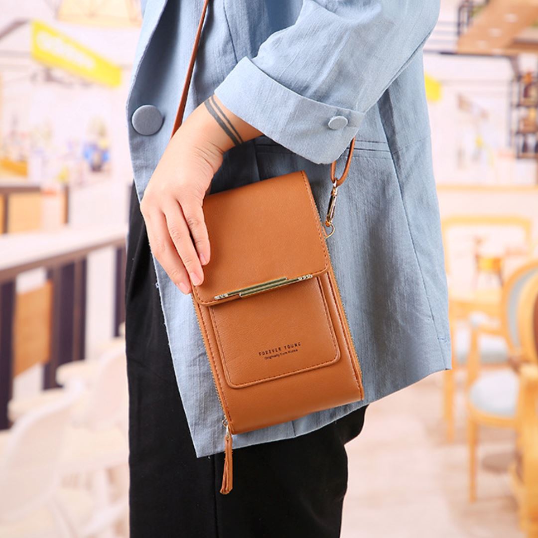 Sleek black compact crossbody phone bag made from durable nylon, featuring a front card holder and an adjustable strap for convenience. Ideal for hands-free 1