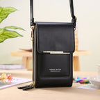 Compact crossbody phone bag in sleek black faux leather, featuring a zippered main compartment, front card holder, and adjustable strap. Ideal for hands-free 6
