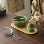 Compact Japanese matcha tea set featuring a stoneware bowl and bamboo whisk, perfect for preparing matcha. The earthy tones of the stoneware enhance the 2