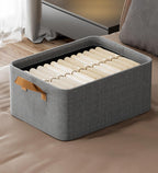 Stylish gray cotton linen storage basket with sturdy handles, designed for easy carrying. Foldable for convenient storage, perfect for organizing toys, clothes, or 7