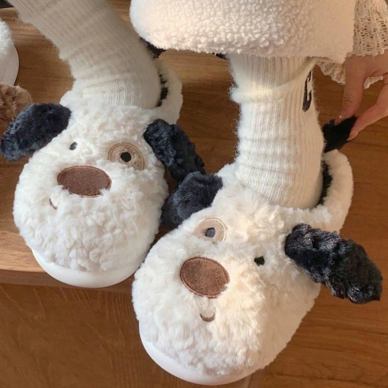 Cozy women's slippers featuring a fluffy Dalmatian print design, perfect for indoor comfort. Made from soft, high-quality materials in a classic black and 4
