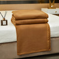 Cozy double-sided velvet blanket in a warm camel color, perfect for all seasons. Soft texture provides comfort and warmth, ideal for snuggling on chilly 3