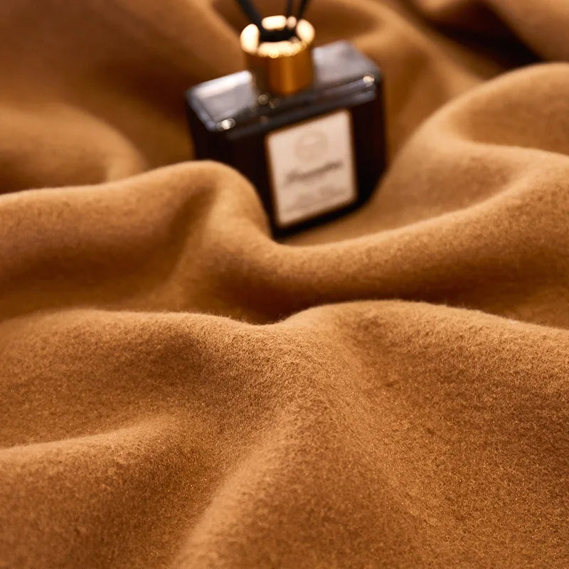 Cozy double-sided velvet blanket in a warm camel color, perfect for all seasons. Soft and luxurious texture, offering warmth and comfort for lounging or bedding 5
