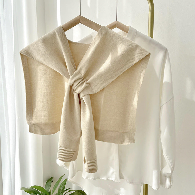 Soft, versatile knit shawl wrap in a warm cream color, perfect for all seasons. Features a cozy, textured design that adds style and warmth to 0