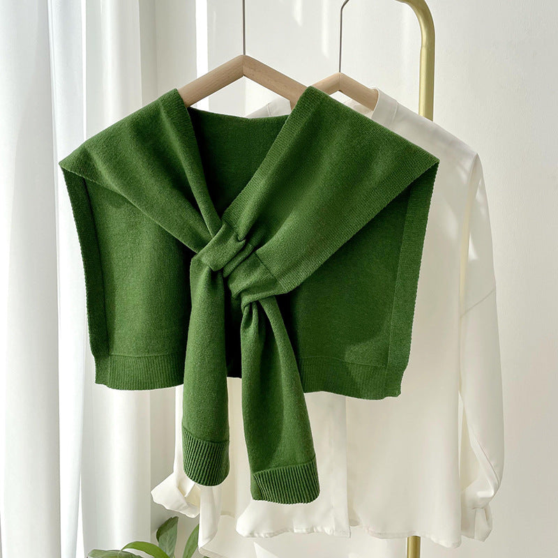Soft, stylish shawl wrap in a cozy knit, perfect for all seasons. Versatile design in a warm cream color, ideal for layering. Lightweight 7