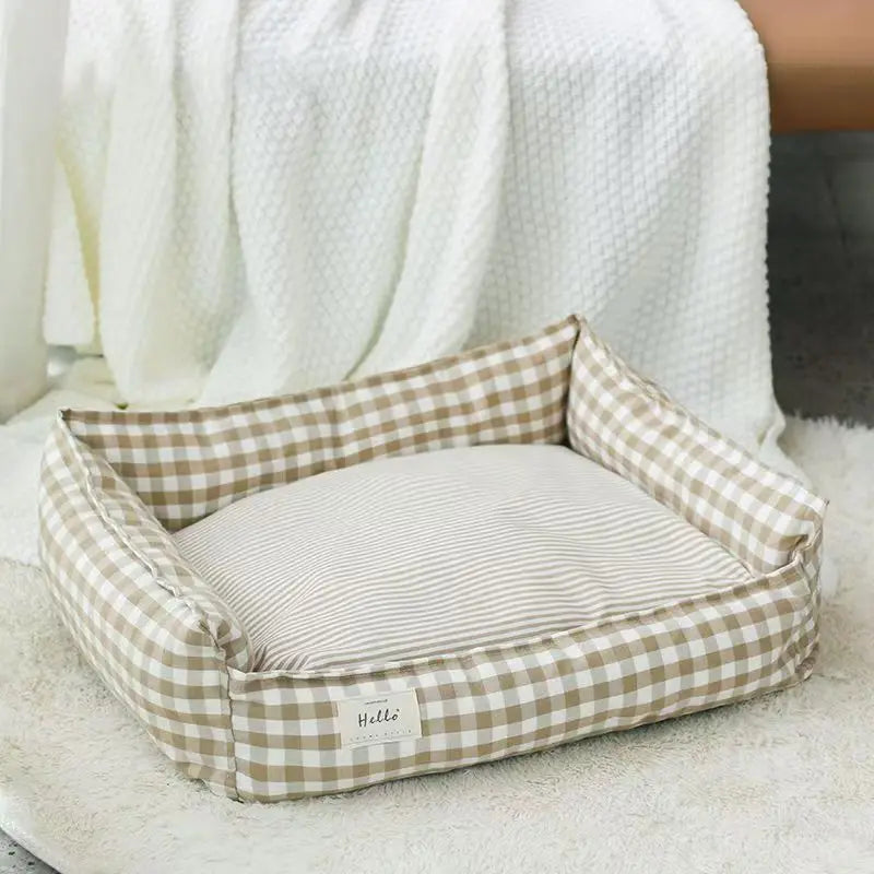 Cozy plaid dog bed designed for small dogs, featuring a soft fabric cushion for comfort. The bed showcases a stylish red and black plaid pattern, perfect 3