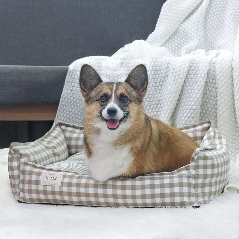 Cozy plaid dog bed designed for small dogs, featuring a soft fabric cushion for ultimate comfort. The bed showcases a stylish red and black plaid pattern, 4