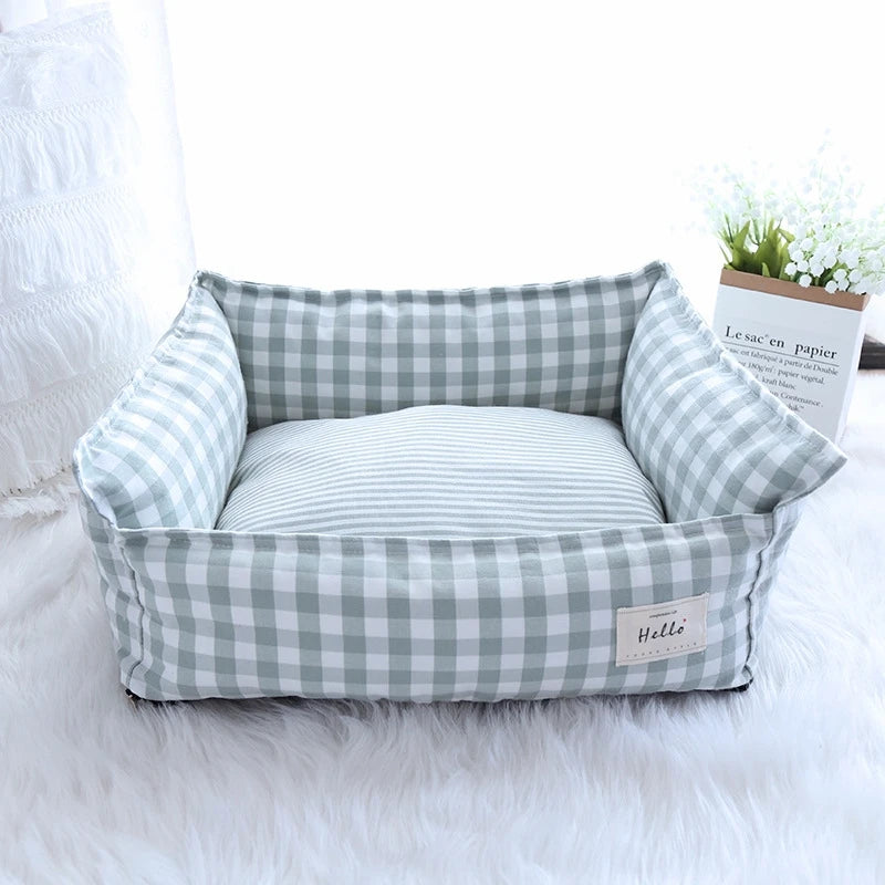 Cozy plaid dog bed designed for small dogs, featuring a soft fabric cushion in a classic red and black pattern. Ideal for comfort, this pet sofa 6