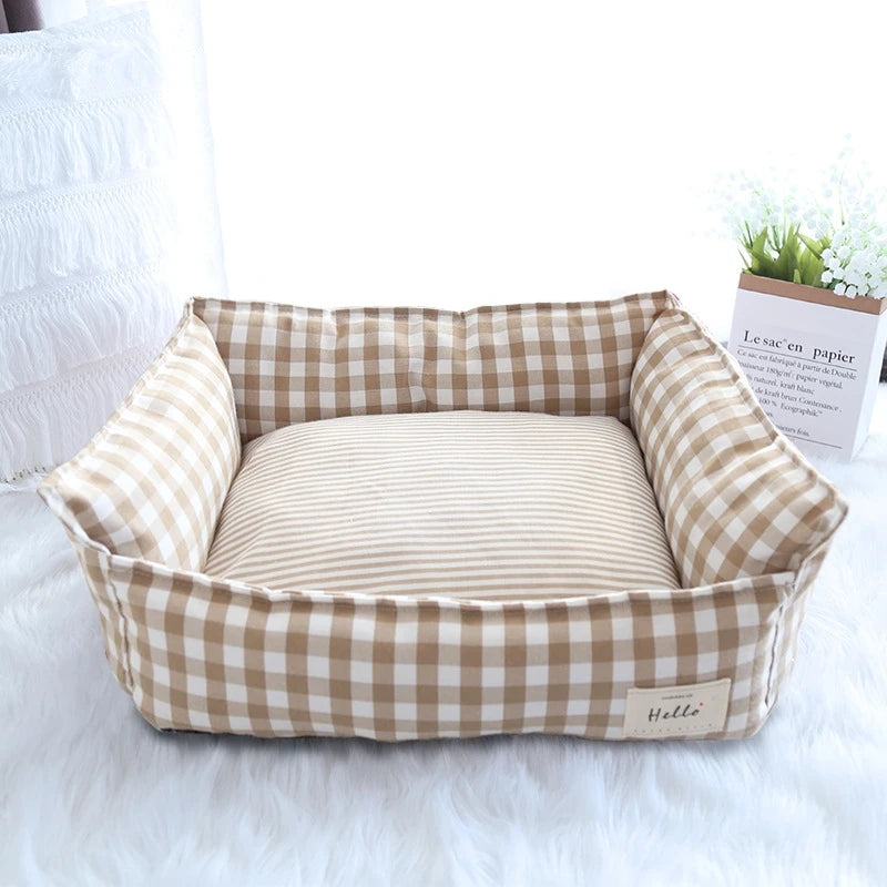 Cozy plaid dog bed designed for small dogs, featuring a soft fabric sofa cushion in a warm red and beige color scheme, ensuring comfort and style for 8