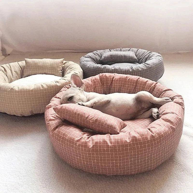 Light gray cozy plush dog bed designed for small to medium pets, featuring a soft, cushioned surface for comfort and a stylish, modern design that complements 1