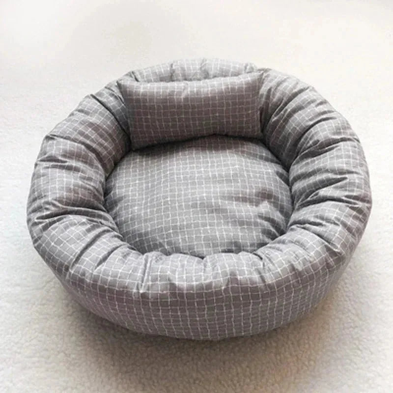 Cozy plush dog bed in light gray, designed for small to medium pets. Features a soft, cushioned surface and raised edges for added comfort. 6