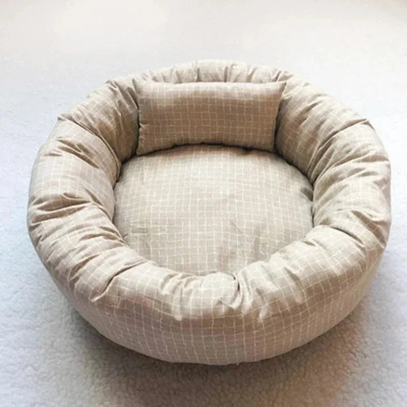 Cozy plush dog bed for small to medium pets in a soft light gray design. Features a comfortable, cushioned surface for relaxation and a stylish look 7
