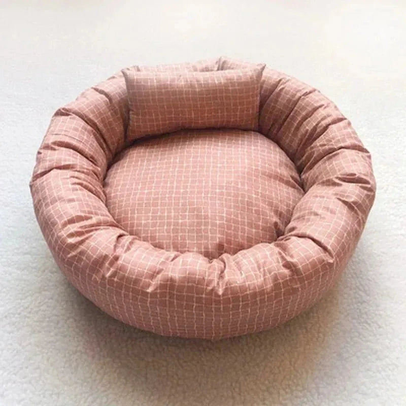 Cozy plush dog bed in light gray, designed for small to medium pets. Features a soft, cushioned surface and raised edges for comfort and support 8