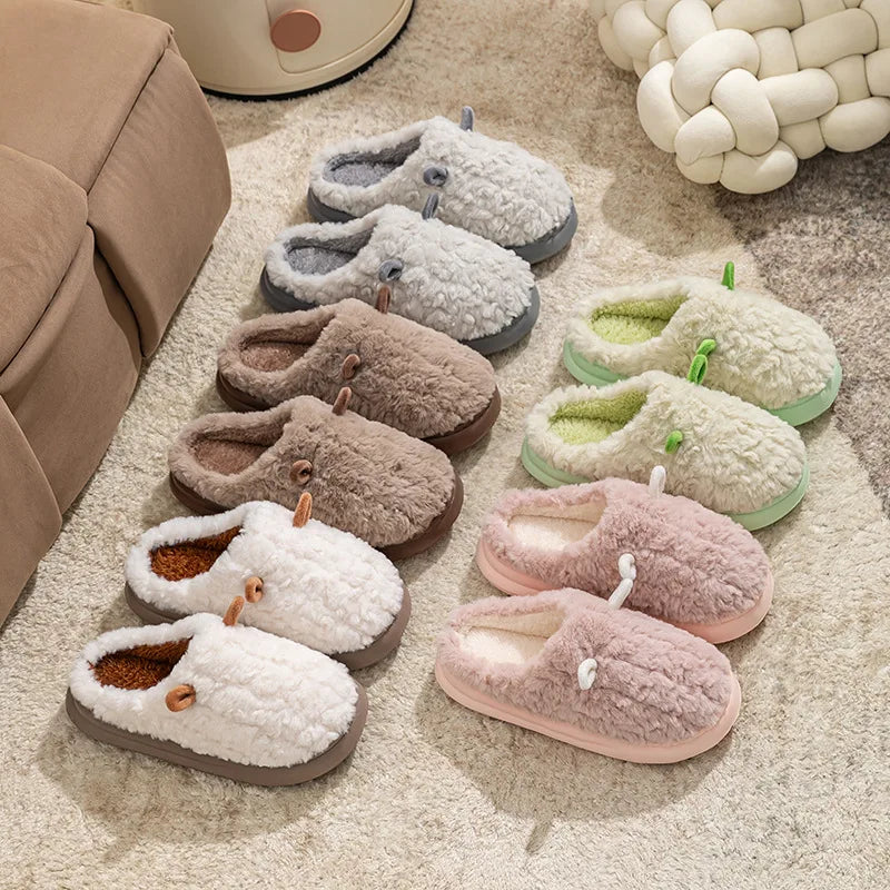 Cozy women's slippers made of plush fleece-lined cotton, designed for winter comfort. The soft, warm slippers feature a classic design in a soothing cream color 3