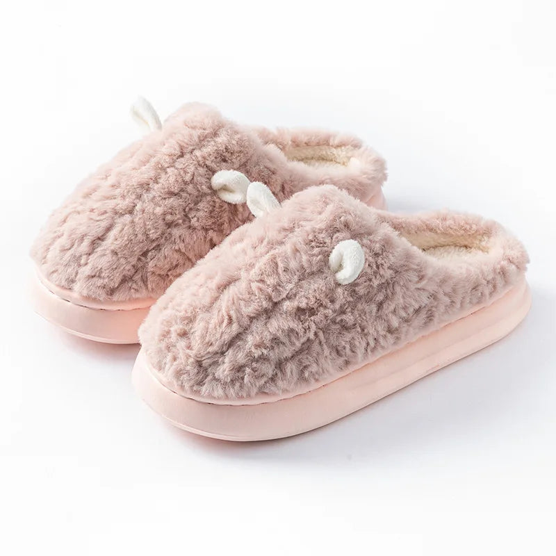 Cozy women's slippers made from plush fleece-lined cotton, featuring a soft gray exterior and a comfortable, cushioned sole, perfect for keeping feet warm during 7