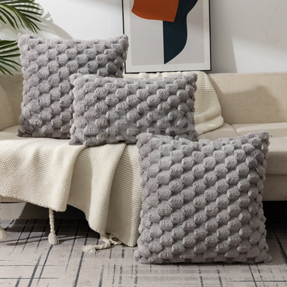 Cream white cushion cover made from a soft cotton-polyester blend, measuring 18 × 18 inches. Ideal for cozy home decor accents, featuring a 5
