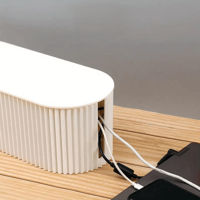 White electronic device with pleated design on a wooden surface