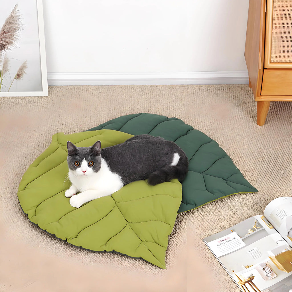 Durable pet sleeping pad for cats and dogs, featuring a stylish leaf design. Made from all-weather materials, it offers comfort and support. The vibrant 0