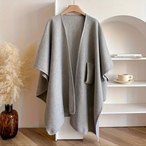 Cozy lightweight fleece shawl wrap in a soft gray hue, featuring a draped design for effortless style and comfort. Perfect for layering, it adds 0