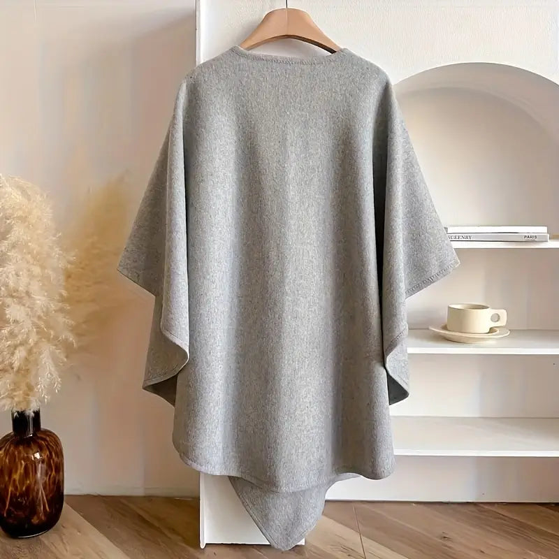 Cozy lightweight fleece shawl wrap in a soft gray hue, featuring a stylish drape that adds elegance and warmth. Perfect for layering over outfits for 2