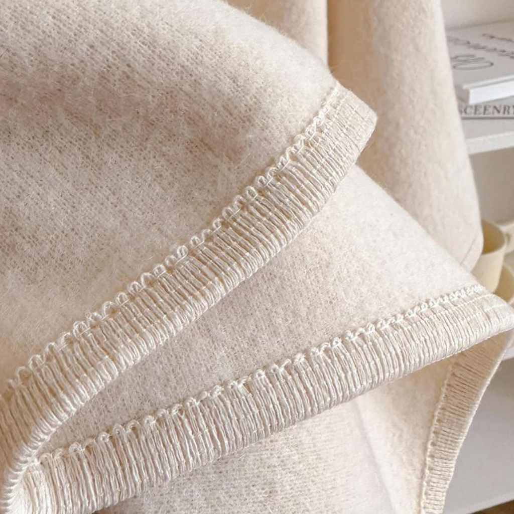 Cozy lightweight fleece shawl wrap in a soft blush pink, designed for stylish comfort. Features a draped silhouette that offers warmth without bulk, perfect 5