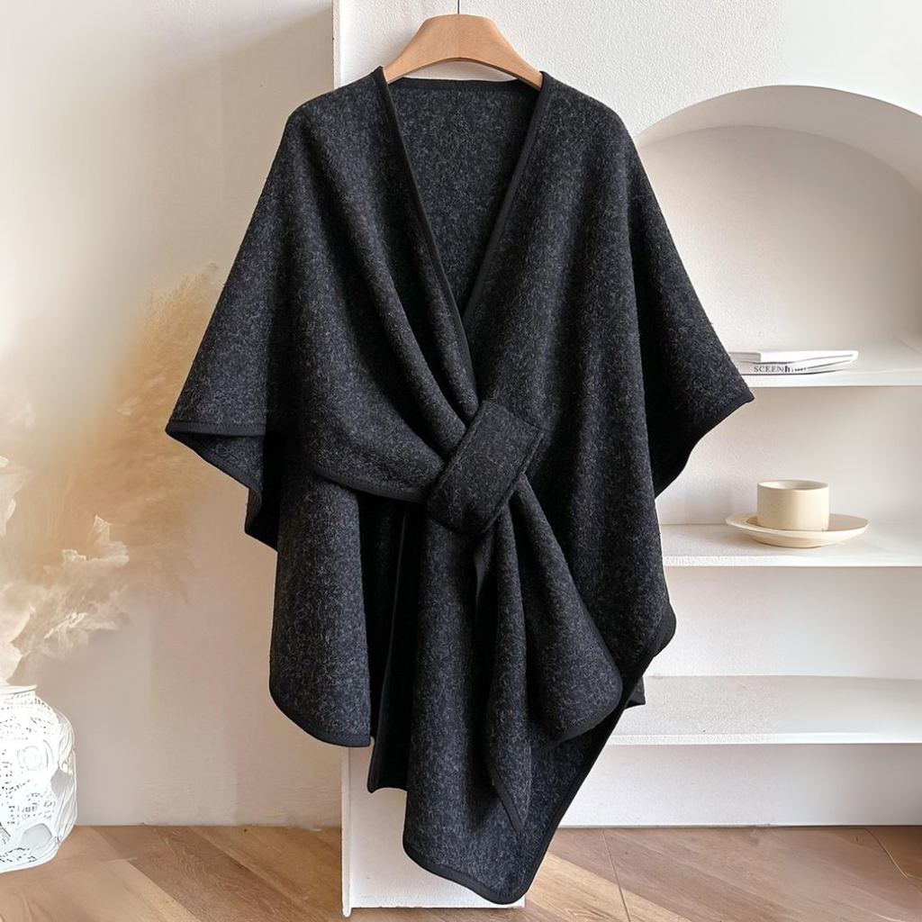 Cozy lightweight fleece shawl wrap in a soft gray hue, featuring a draped design for stylish comfort. Ideal for layering, this versatile accessory adds 6