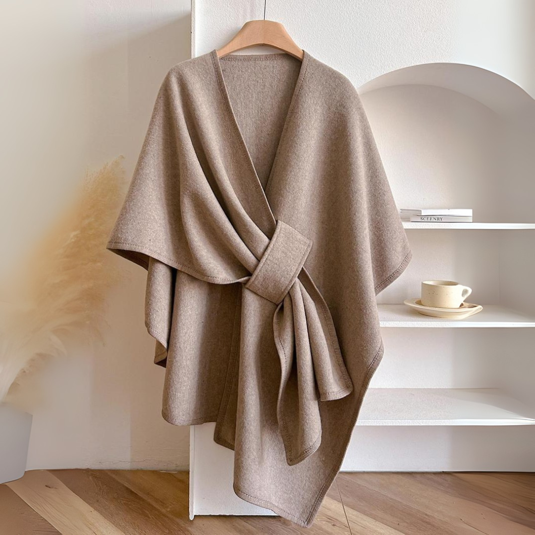 Cozy lightweight fleece shawl wrap in a soft gray hue, featuring a draped design for stylish comfort. Perfect for layering, it offers warmth without 8
