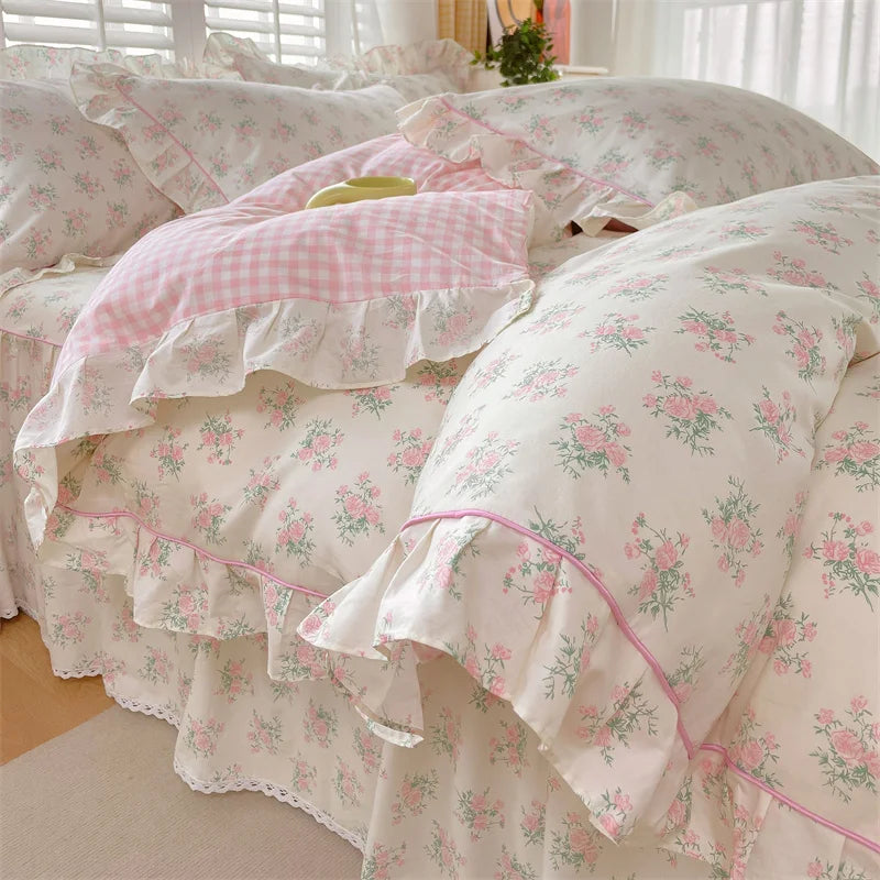 Floral cotton duvet cover queen set featuring a delicate ruffle edge, designed for cozy bedrooms. The soft fabric showcases a vibrant floral pattern in pastel colors 1