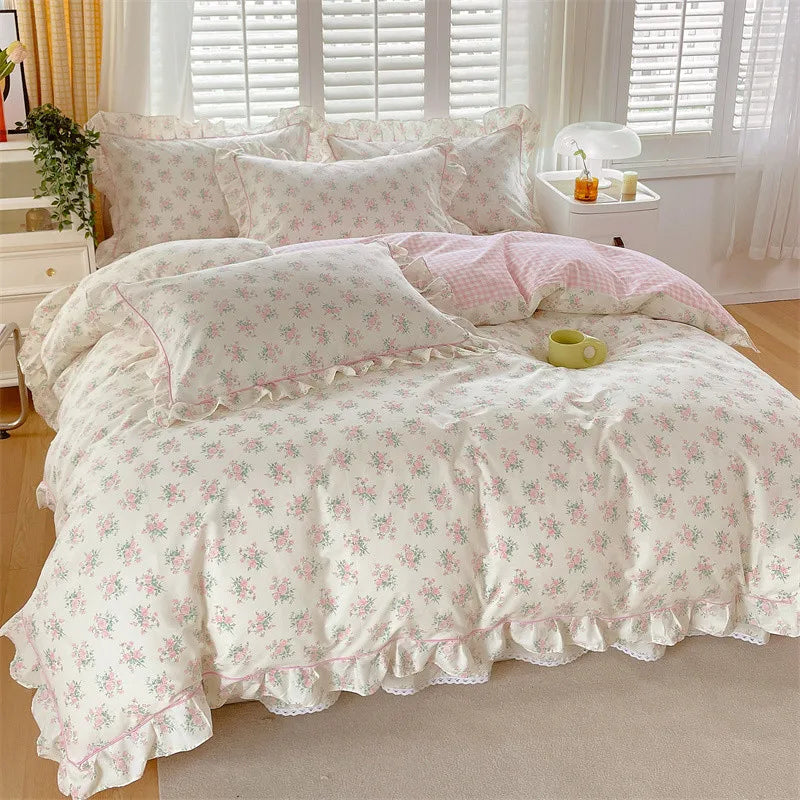 Floral cotton duvet cover queen set featuring a delicate ruffle edge, perfect for cozy bedrooms. The design showcases soft pastel flowers on a white background, 2