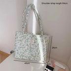 Floral quilted tote bag featuring a vibrant flower pattern, perfect for summer outings. Made from durable fabric with sturdy handles, this cute beach bag combines 6