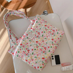 Floral quilted tote bag featuring a vibrant flower pattern, perfect for summer outings. Made from durable canvas with sturdy handles, ideal for beach trips and 7