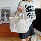 Floral quilted tote bag with vibrant flower pattern, perfect for beach outings and everyday use. Made from durable, lightweight fabric in bright colors, featuring 4