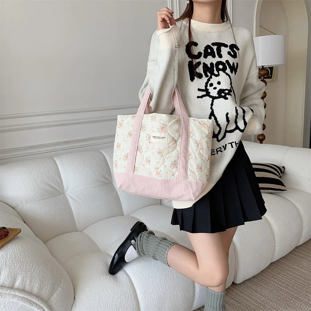 Floral quilted tote bag featuring vibrant flower patterns, perfect for beach outings or daily errands. Made from durable fabric with sturdy handles, it combines style 5